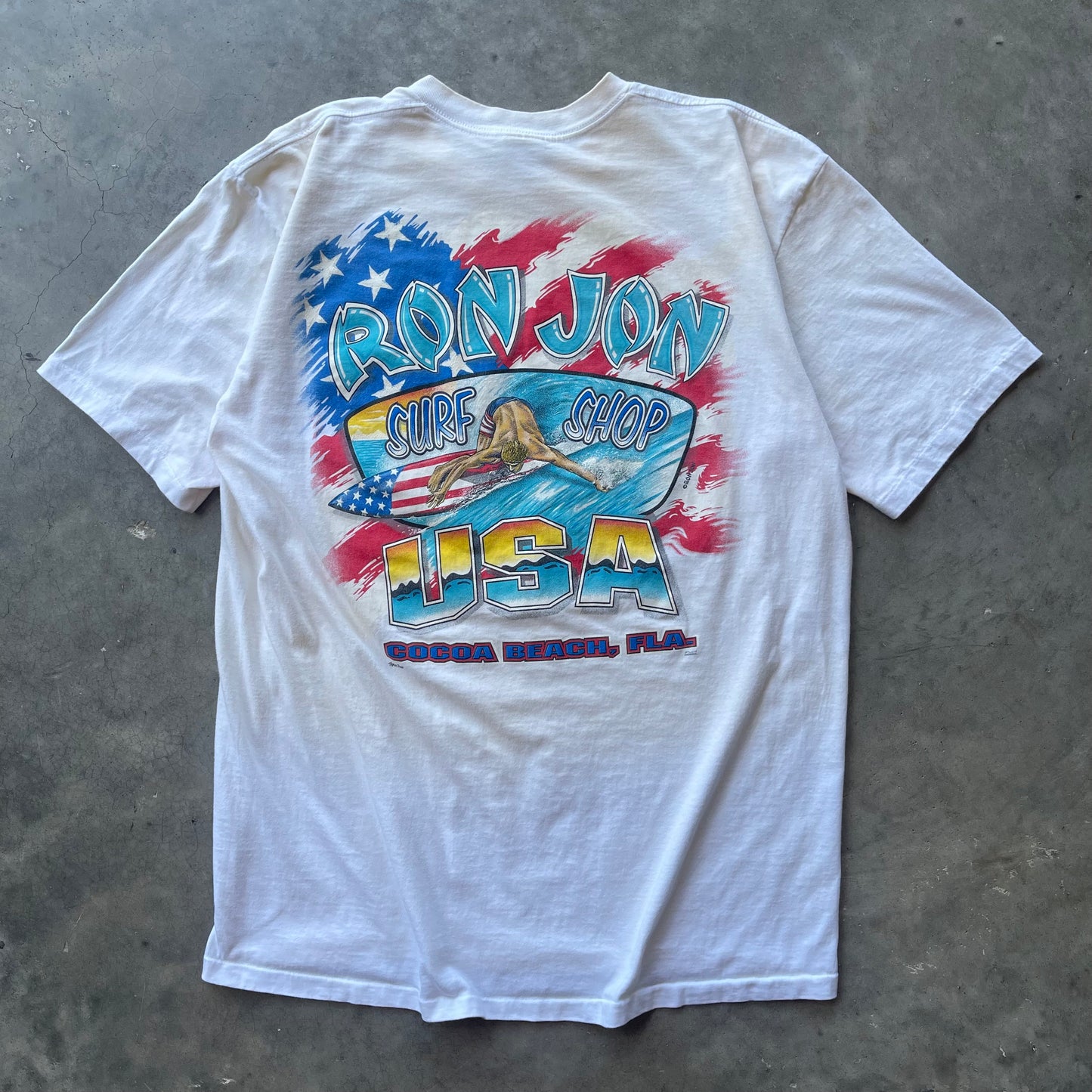 (XL) 90s Ron Jon Surf Shop “USA” Surfer Graphic Pocket Tee